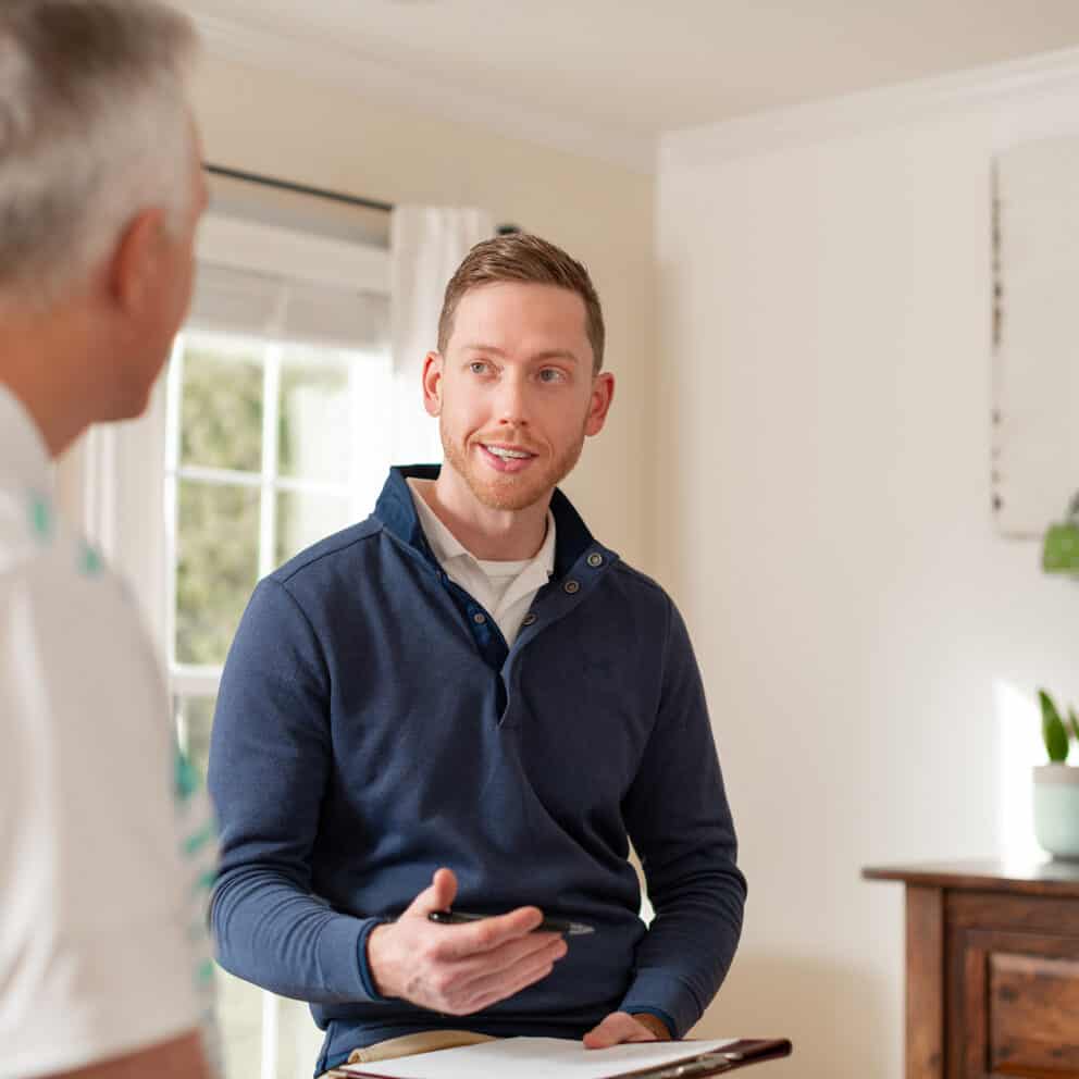 Andy Royalty speaking with patient